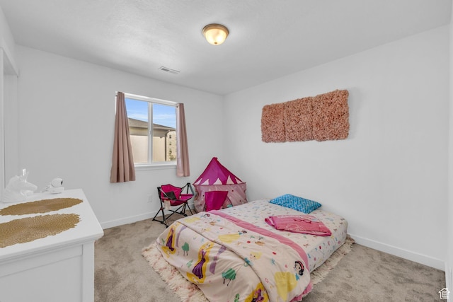 bedroom featuring visible vents, carpet flooring, and baseboards