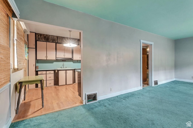 2481 Van Buren Ave, Ogden, UT 84401 - interior space with baseboards, visible vents, light colored carpet, and a sink