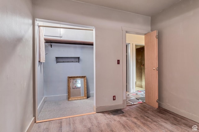 2481 Van Buren Ave, Ogden, UT 84401 - unfurnished bedroom featuring visible vents, baseboards, wood finished floors, and a closet