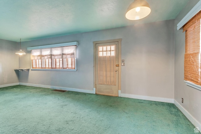 2481 Van Buren Ave, Ogden, UT 84401 - carpeted entryway featuring baseboards and visible vents