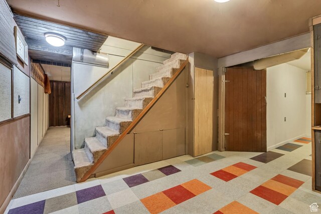 2481 Van Buren Ave, Ogden, UT 84401 - finished below grade area with stairway, baseboards, and tile patterned floors