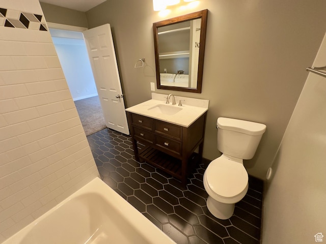 full bathroom with toilet and vanity