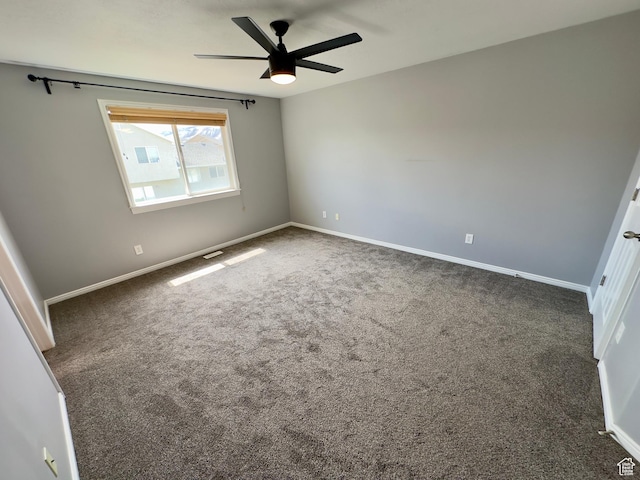 unfurnished bedroom featuring carpet flooring, baseboards, and a ceiling fan