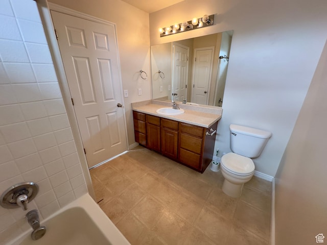 bathroom with toilet, vanity, baseboards, tile patterned flooring, and  shower combination