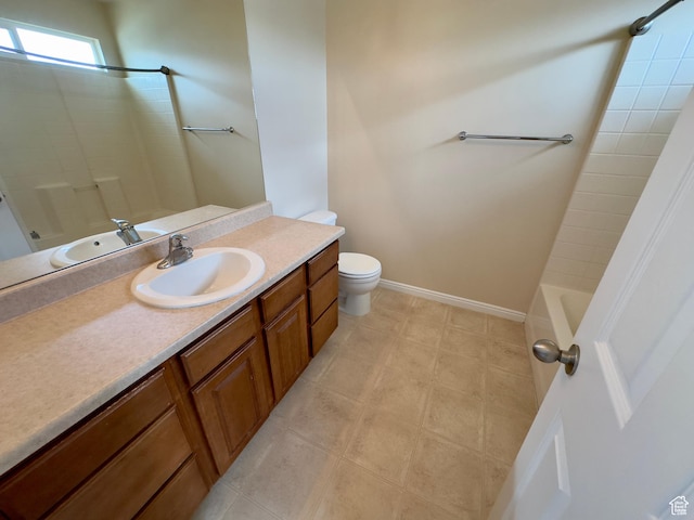 bathroom with toilet, vanity, bathing tub / shower combination, and tile patterned floors