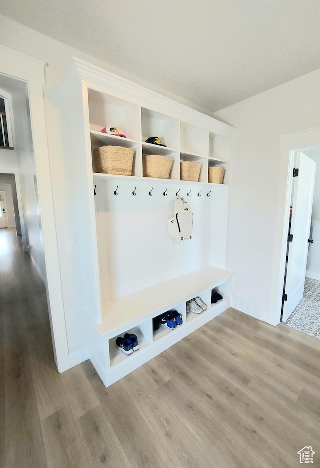 mudroom with wood finished floors