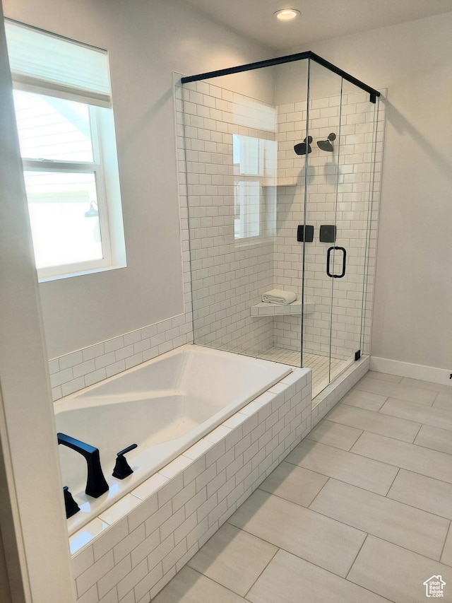 full bath featuring a stall shower, a garden tub, tile patterned floors, baseboards, and recessed lighting