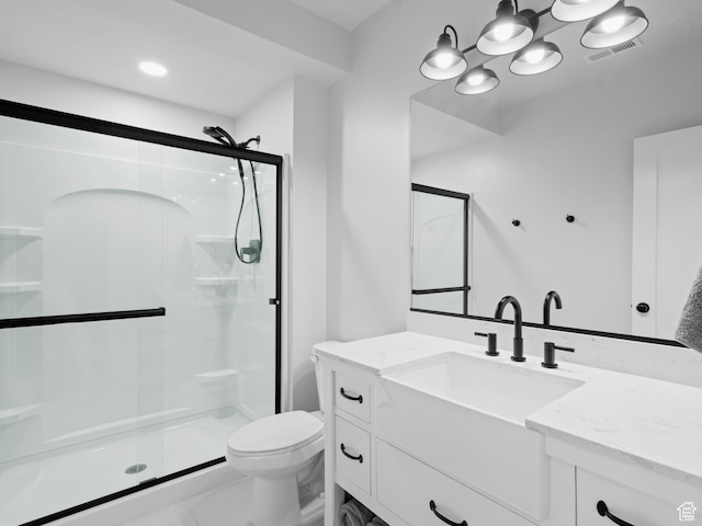 full bath featuring a shower stall, toilet, and vanity