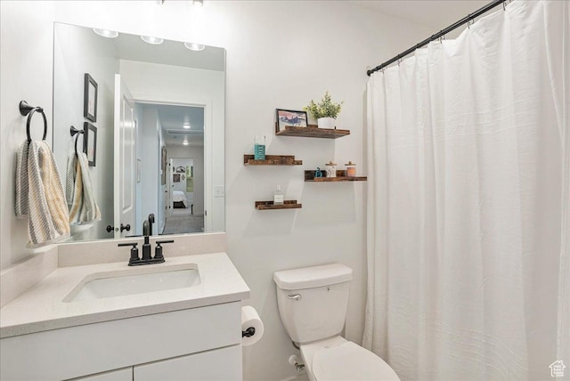 full bathroom with vanity and toilet