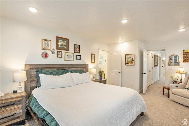 bedroom with recessed lighting, baseboards, and light carpet