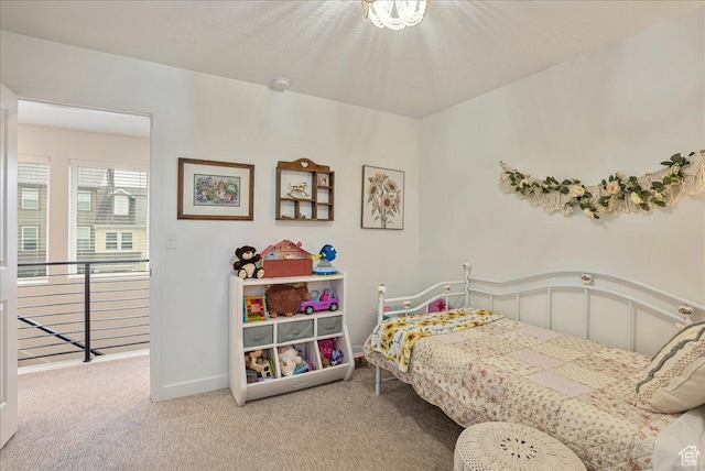 carpeted bedroom with baseboards