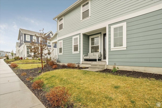 exterior space with a residential view and a yard