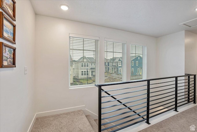stairway featuring baseboards, carpet floors, and recessed lighting