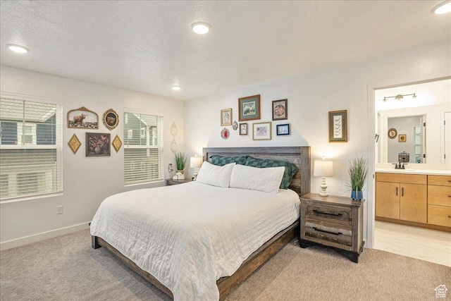 bedroom with light carpet, baseboards, and multiple windows