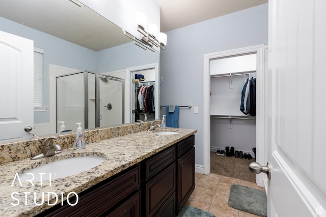 277 N Havenwood Dr W, Kaysville, UT 84037 - full bath featuring double vanity, a shower stall, tile patterned flooring, and a sink