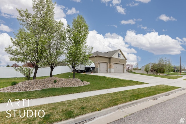 277 N Havenwood Dr W, Kaysville, UT 84037 - view of front of home featuring fence, an attached garage, driveway, and a front yard