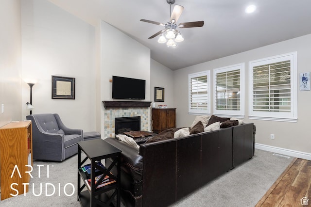277 N Havenwood Dr W, Kaysville, UT 84037 - living area with vaulted ceiling, baseboards, wood finished floors, ceiling fan, and a stone fireplace