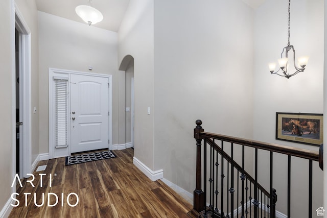 277 N Havenwood Dr W, Kaysville, UT 84037 - foyer featuring arched walkways, a notable chandelier, wood finished floors, and baseboards