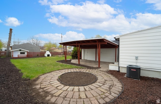 1131 W Simondi Ave N, Salt Lake City, UT 84116 - view of yard with central air condition unit, an outdoor structure, fence, and a garage