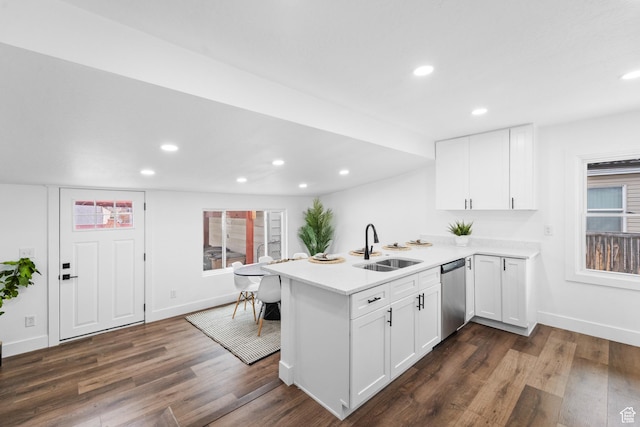1131 W Simondi Ave N, Salt Lake City, UT 84116 - kitchen with a peninsula, stainless steel dishwasher, a sink, and baseboards