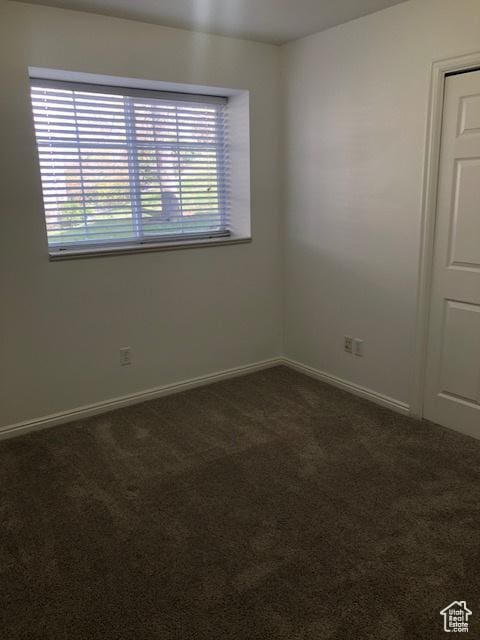1529 W Westbury Way Unit C, Lehi, UT 84043 - spare room with dark carpet, baseboards, and plenty of natural light