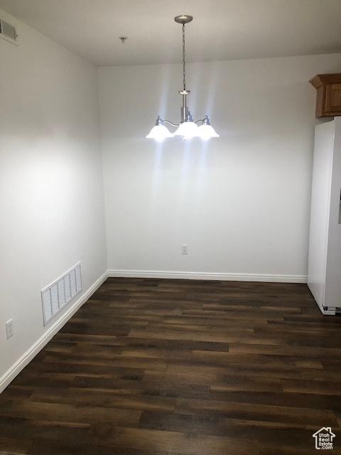 1529 W Westbury Way Unit C, Lehi, UT 84043 - unfurnished dining area featuring baseboards, visible vents, and dark wood finished floors