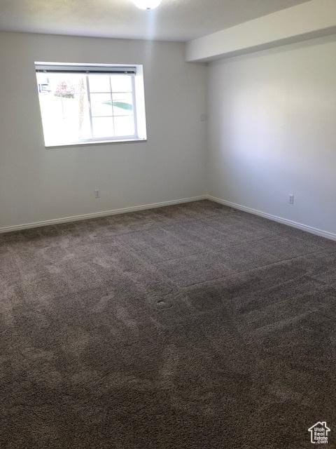 1529 W Westbury Way Unit C, Lehi, UT 84043 - empty room with baseboards and dark colored carpet