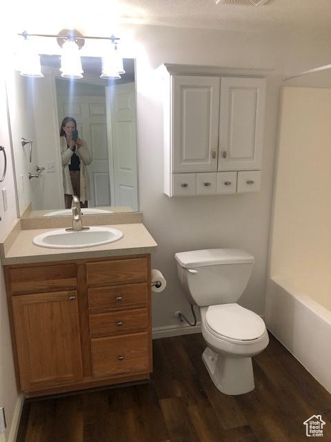 1529 W Westbury Way Unit C, Lehi, UT 84043 - full bath with wood finished floors, toilet, and vanity