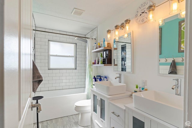 full bath with shower / tub combo with curtain, visible vents, toilet, and a sink