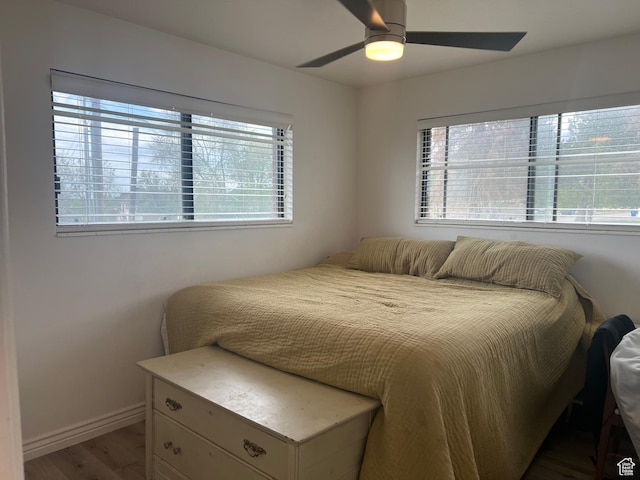 3415 W N Pln, City Road, Plain City, UT 84404 - bedroom with ceiling fan, baseboards, and wood finished floors