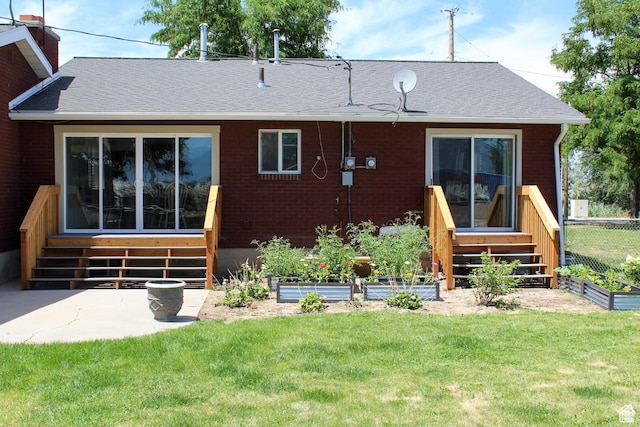 3415 W N Pln, City Road, Plain City, UT 84404 - back of property with a yard, entry steps, a shingled roof, and a vegetable garden
