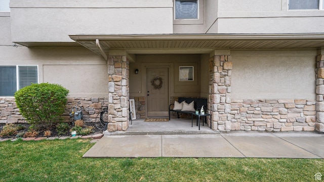 6661 W Merlot Way, West Jordan, UT 84081 - doorway to property with stucco siding and stone siding
