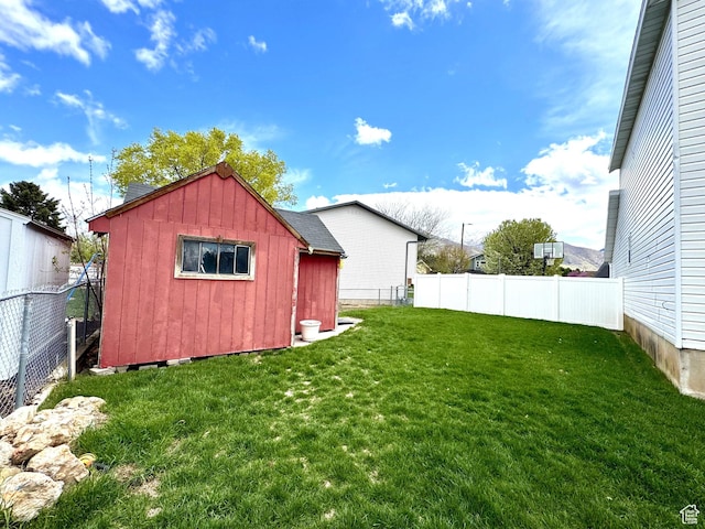 977 S Via La Costa Way, Kaysville, UT 84037 - view of yard with a fenced backyard, an outbuilding, and a storage shed