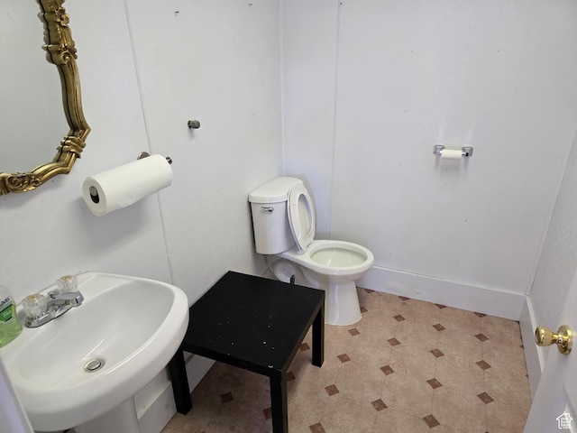 380 N 200 W, Fillmore, UT 84631 - bathroom with baseboards, toilet, tile patterned floors, and a sink