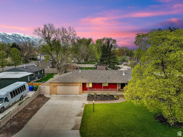 1936 E La Cresta Dr, Cottonwood Heights, UT 84121 - ranch-style house with concrete driveway, a chimney, a lawn, covered porch, and an attached garage