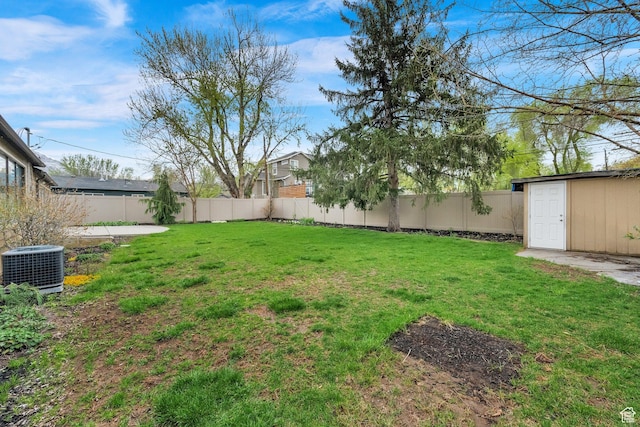 1936 E La Cresta Dr, Cottonwood Heights, UT 84121 - view of yard featuring an outdoor structure, a fenced backyard, and central AC unit