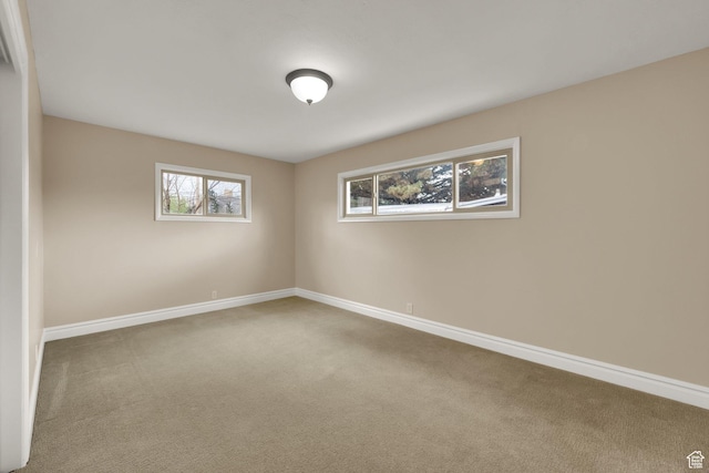 1936 E La Cresta Dr, Cottonwood Heights, UT 84121 - carpeted spare room featuring baseboards and a healthy amount of sunlight