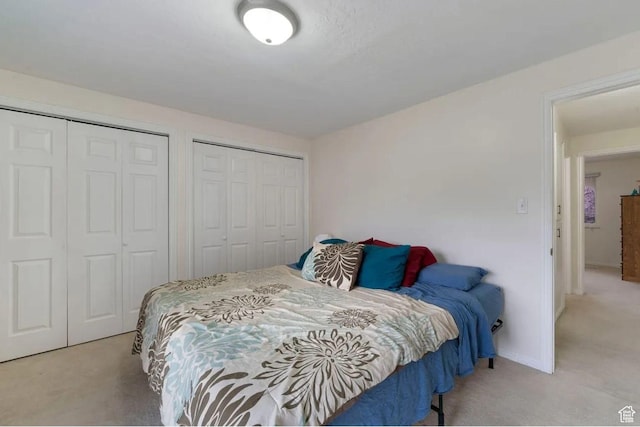1465 W Arthur Dr, Provo, UT 84601 - bedroom with multiple closets, baseboards, and light colored carpet