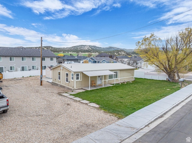 345 E 100 S, Coalville, UT 84017 - ranch-style home featuring a mountain view, fence, a residential view, and metal roof