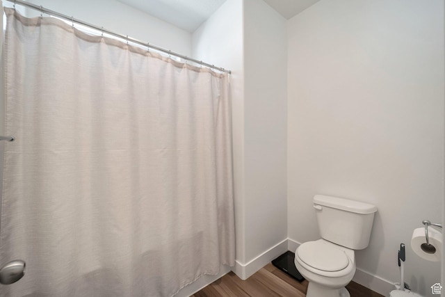 13537 S Commodus Dr W Unit 304, Riverton, UT 84096 - full bath featuring baseboards, toilet, and wood finished floors