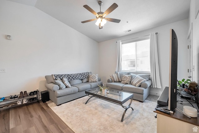 13537 S Commodus Dr W Unit 304, Riverton, UT 84096 - living room featuring vaulted ceiling, visible vents, a ceiling fan, and light wood-type flooring