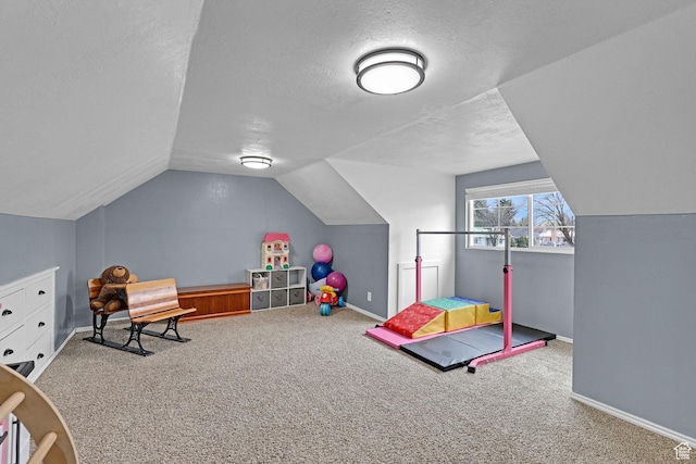 275 E 1st S, Preston, ID 83263 - rec room featuring carpet floors, a textured ceiling, lofted ceiling, and baseboards