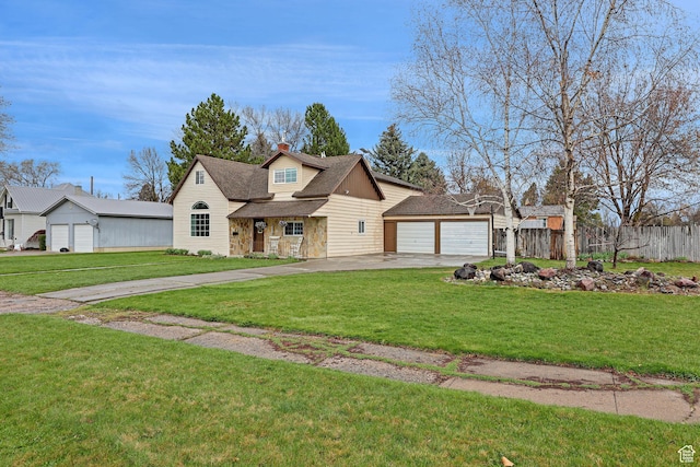 275 E 1st S, Preston, ID 83263 - view of front of house with a front lawn, driveway, stone siding, a chimney, and fence