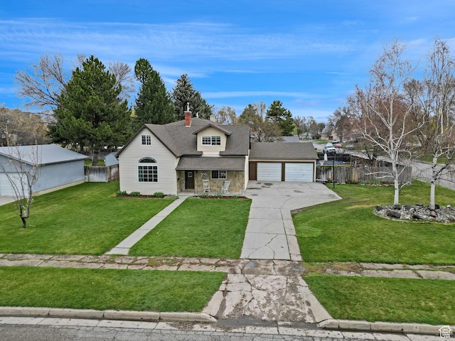 275 E 1st S, Preston, ID 83263 - view of front of property featuring fence, driveway, a front yard, and a garage