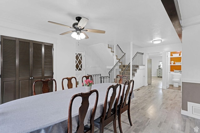 275 E 1st S, Preston, ID 83263 - dining space featuring visible vents, a ceiling fan, baseboards, light wood-style flooring, and stairs