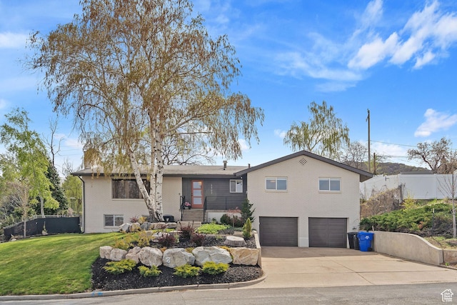 ranch-style house with concrete driveway, fence, brick siding, an attached garage, and a front yard