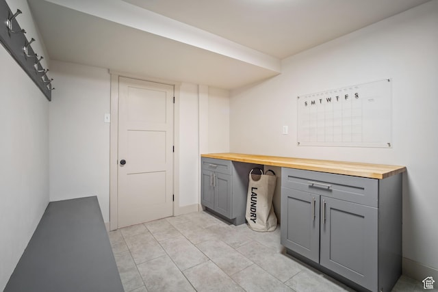laundry room with light tile patterned flooring
