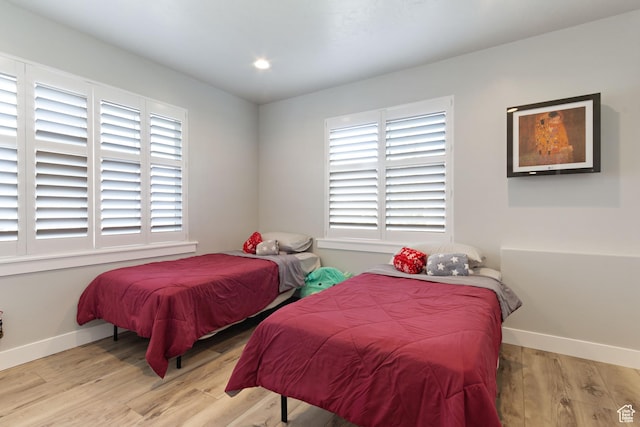 6982 W Majestic View Ln S, Herriman, UT 84096 - bedroom with baseboards, light wood-style floors, and recessed lighting