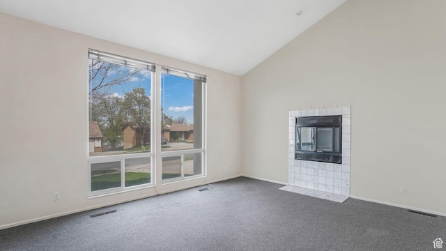 unfurnished living room featuring baseboards, visible vents, and carpet