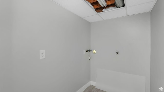 laundry room with electric dryer hookup, laundry area, and baseboards
